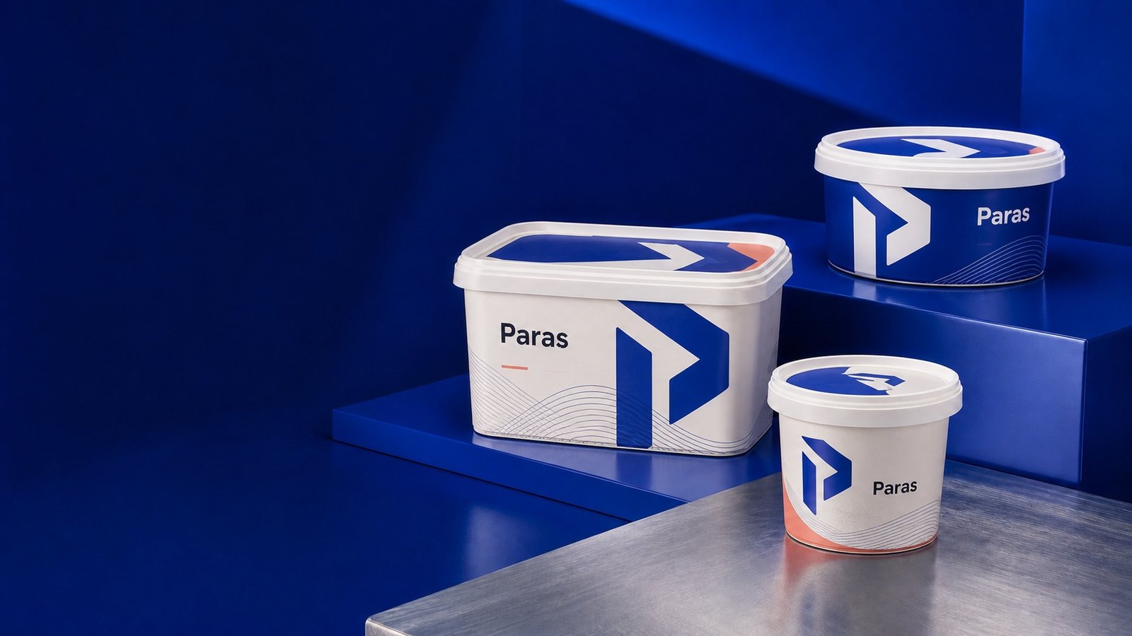 Paras branded in-mould labelled containers in a blue studio setting